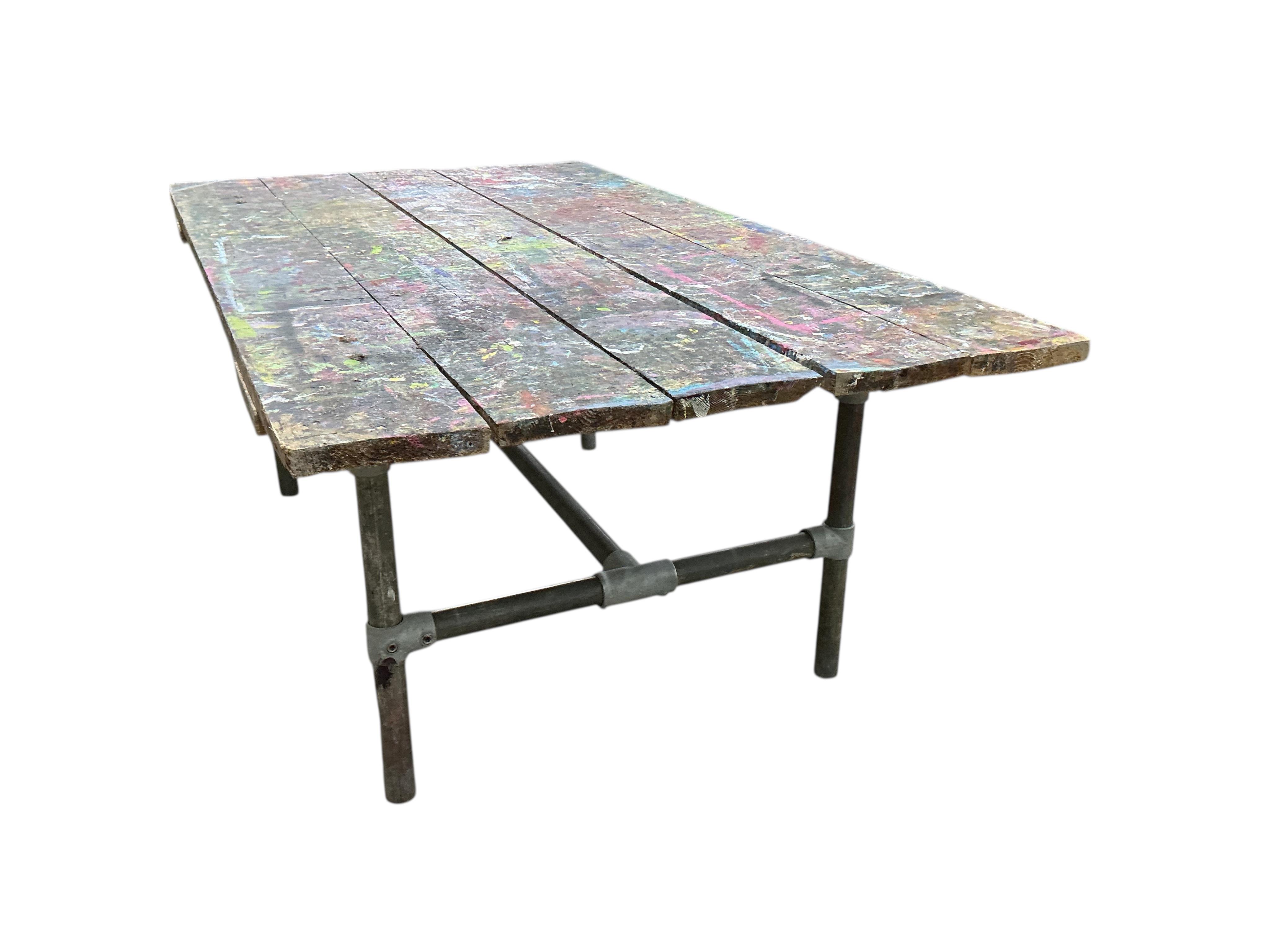 An industrial style rectangular artist's studio work table, width 195cm, depth 112cm, height 75cm